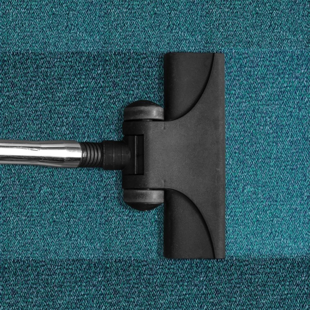 carpet cleaner of a blue-green carpet