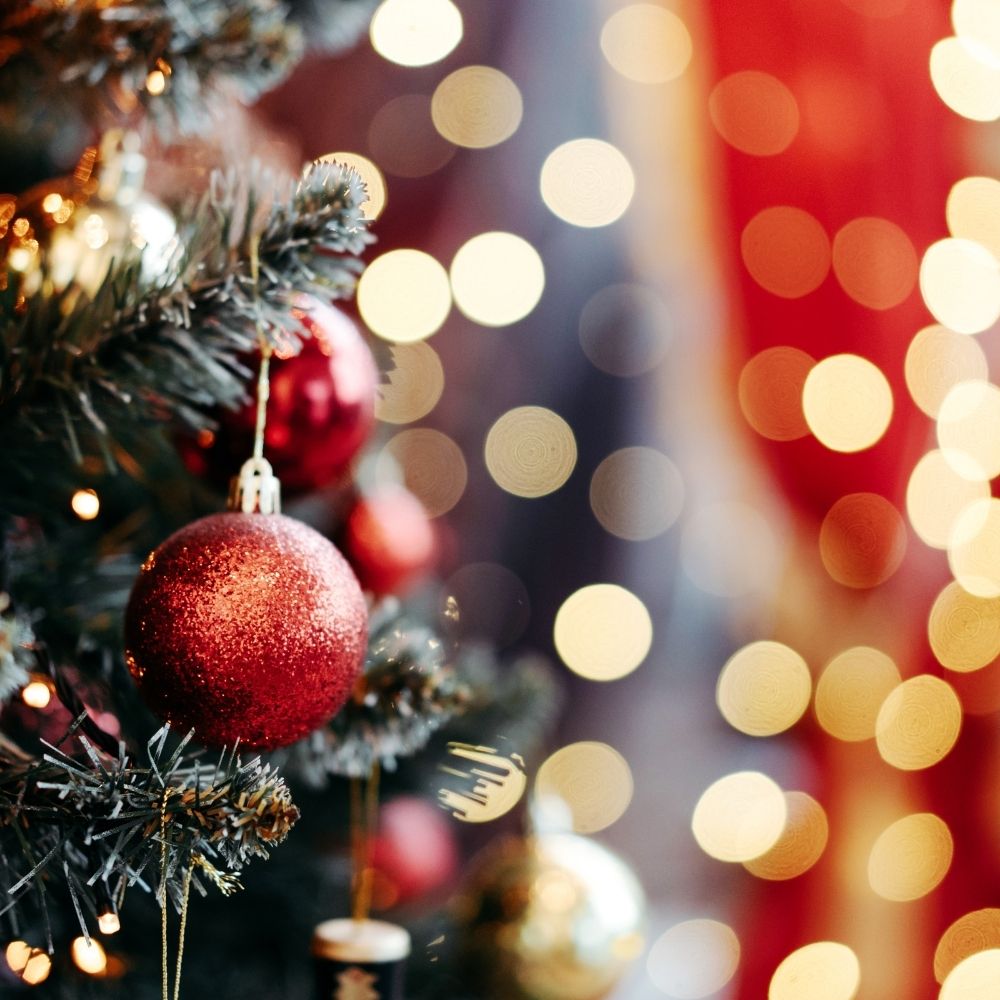 christmas tree with lights in the background