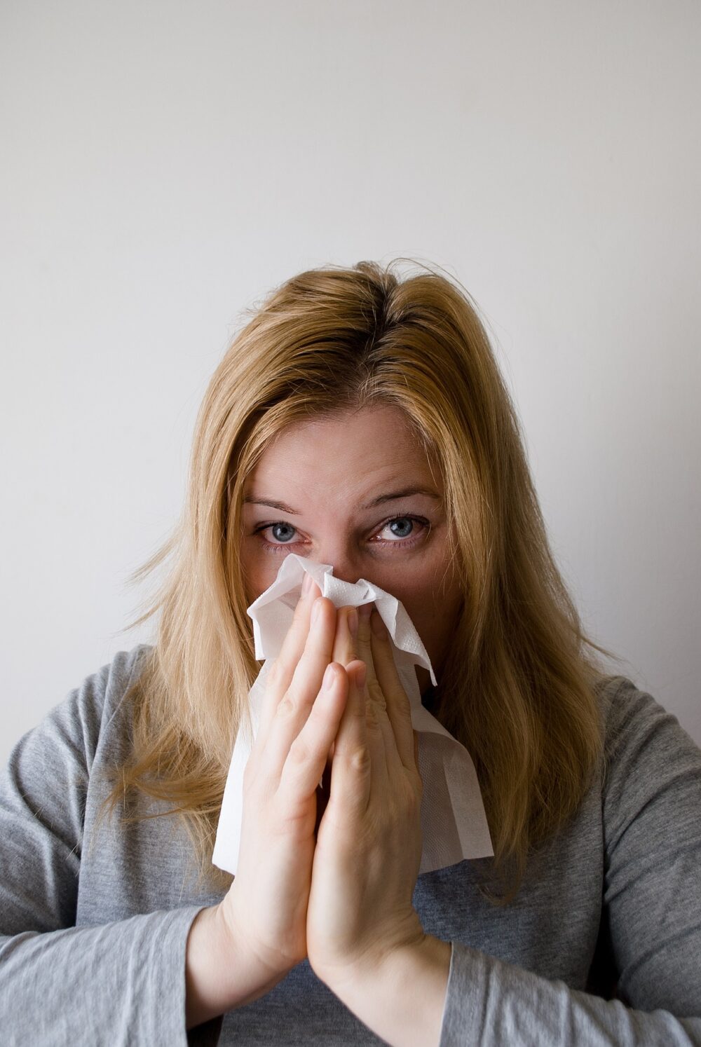 Women Blowing her Nose