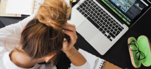 women sat in front of a laptop