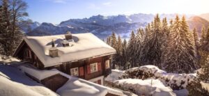 looking down on a home with snow on roof it via canva