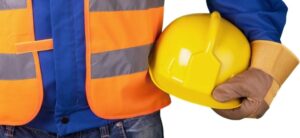person holding a hard hat and wearing a florescent vest