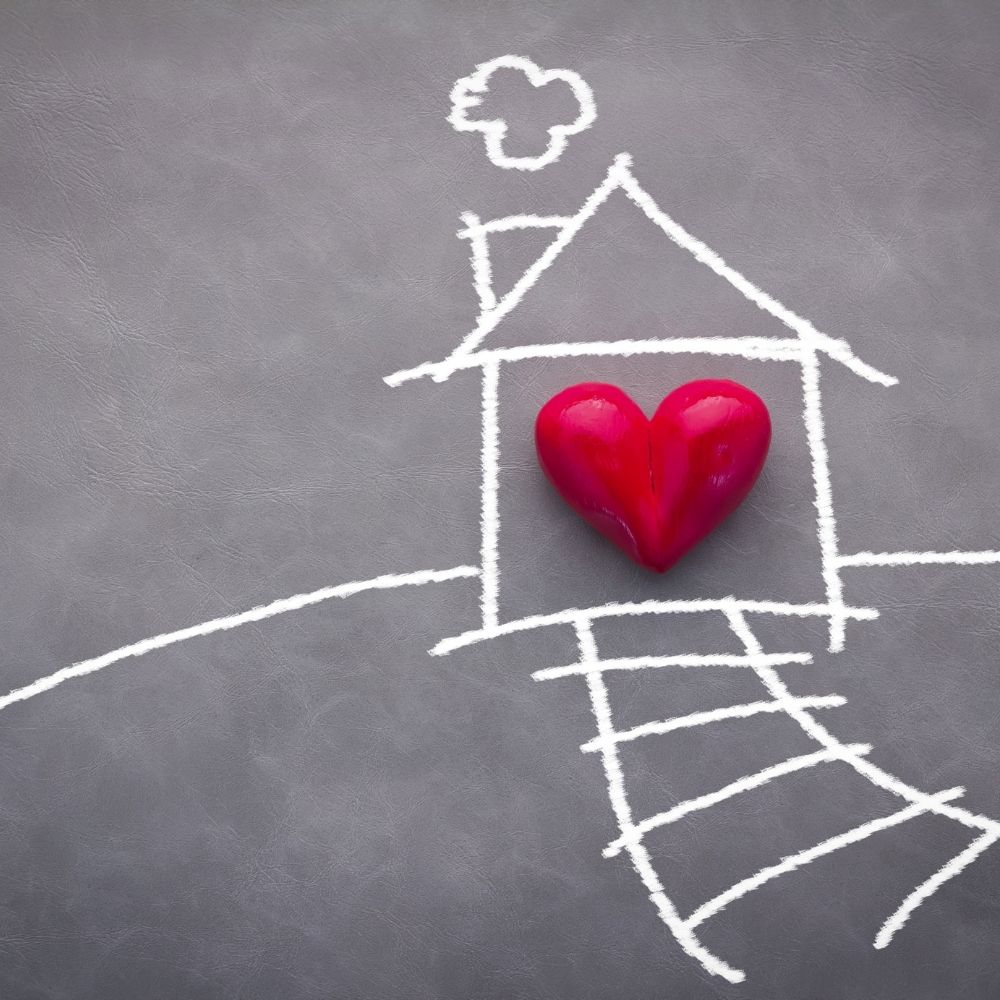 drawing of a home with a read heart inside