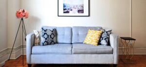 light blue sofa with photo above