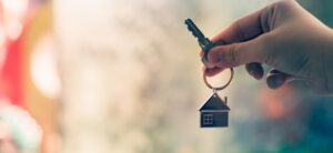 person holding a key to a house