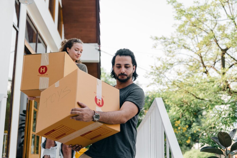 Man moving packaging boxes ready for moving