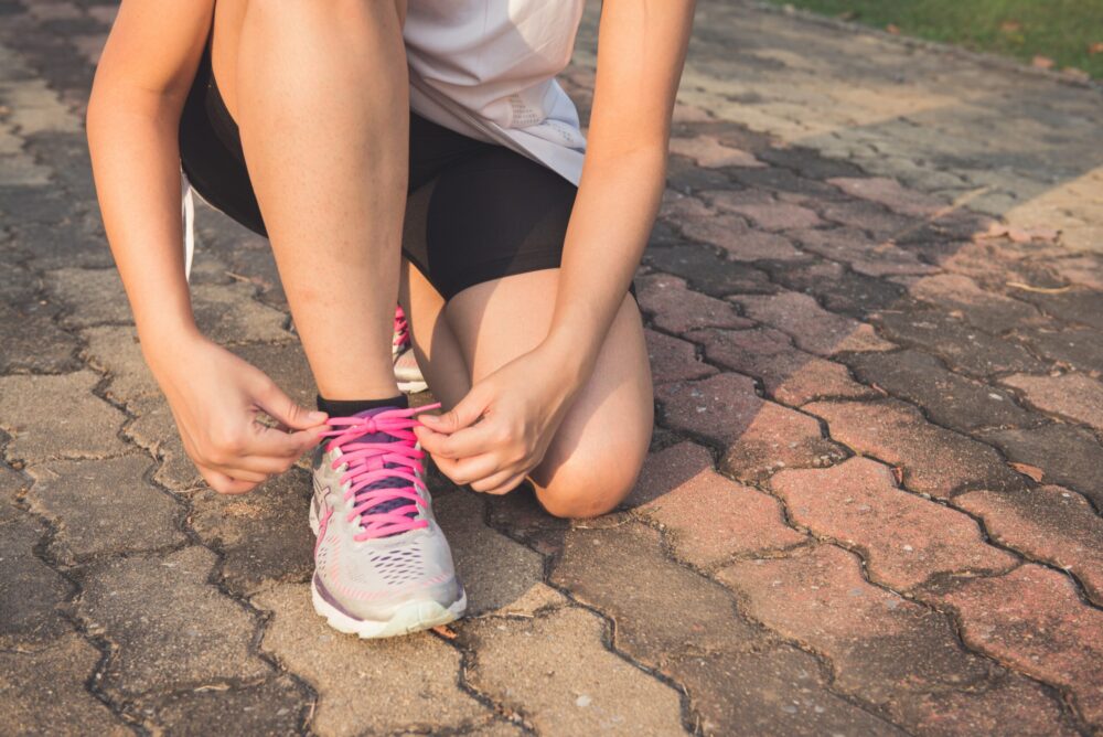 Women tying her trainers up