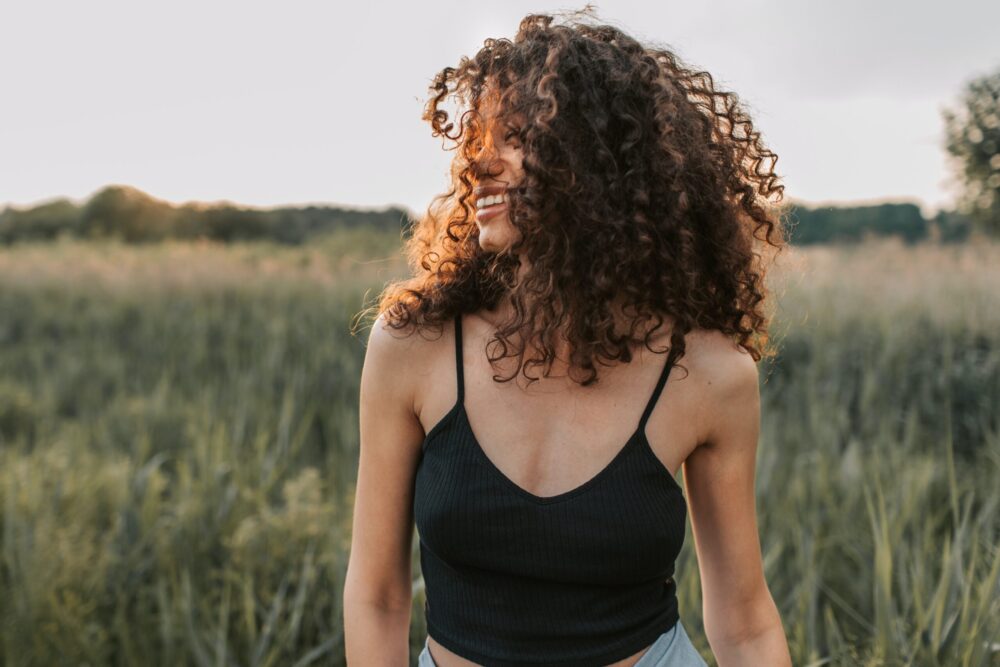 women looking happy in a field