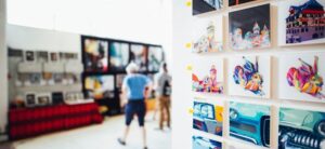 room full of different art on canvas