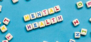 mental health written in colourful beads