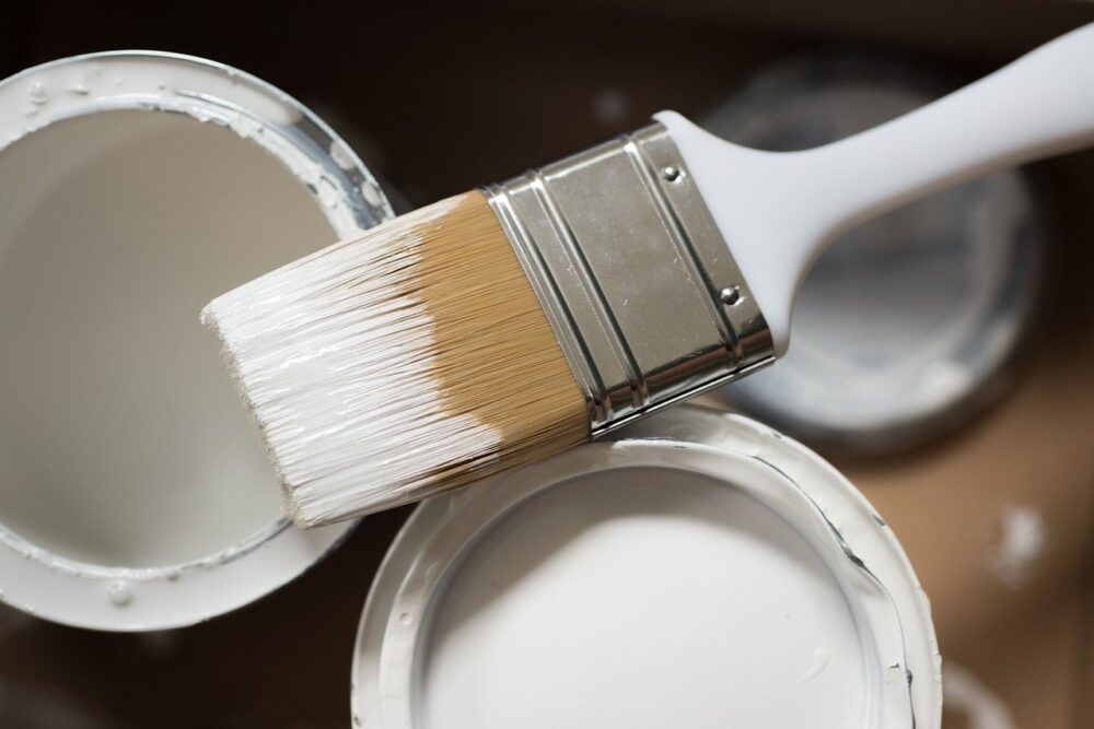 white paint on a paint brush
