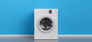 white washing machine against a blue backdrop