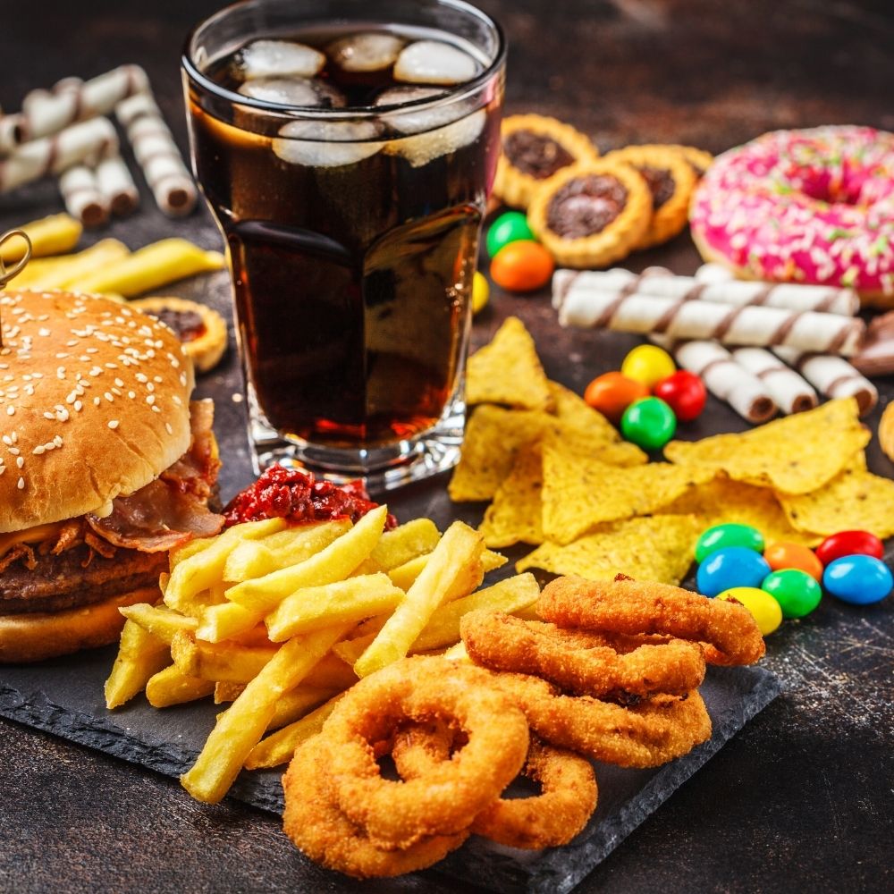 selection of bad foods and fizzy drinks