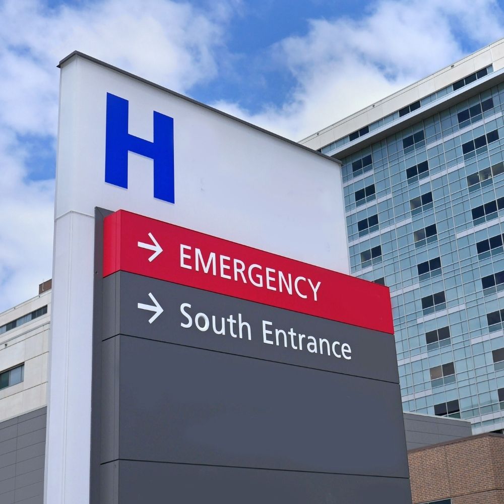 Hospital sign showing emergency and south entrance