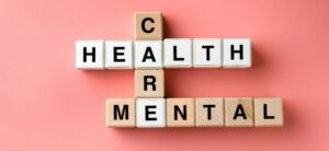 care mental health written using scrabble tiles