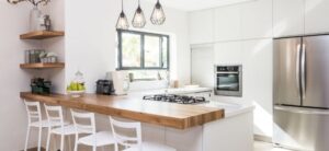 light and bright kitchen area with cooker and double fridge