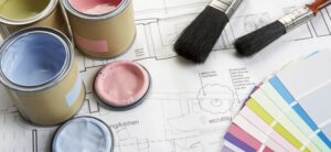 paints paintbrushes and colour swatches