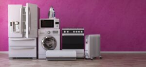 selection of home appliances against a pink back ground