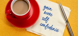 cup of tea with a note saying gain more confidence