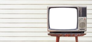 old style TV stood on a stool