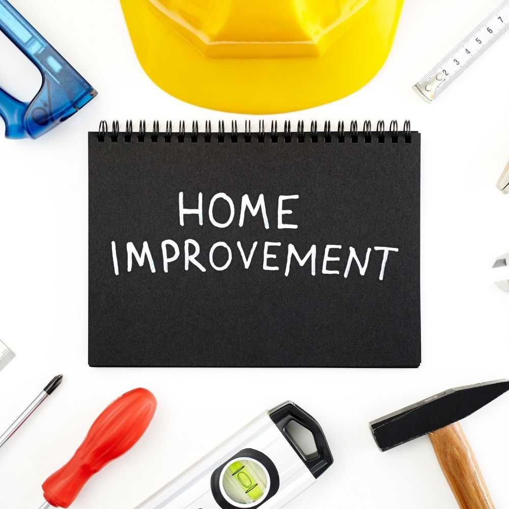 the words home improvement surrounded by tools