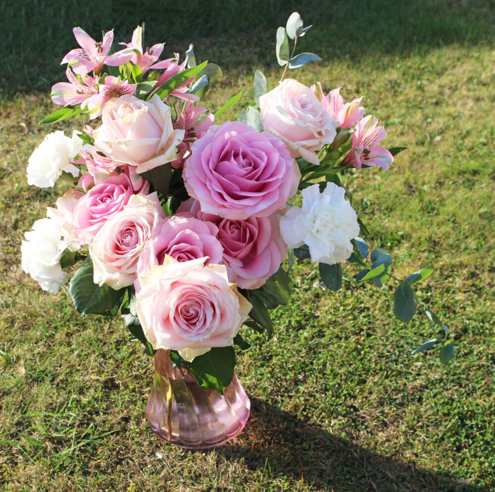 The Tyra from LOV Flowers Day of arriving pink Sweet Avalanche Roses and fragrant eucalyptus