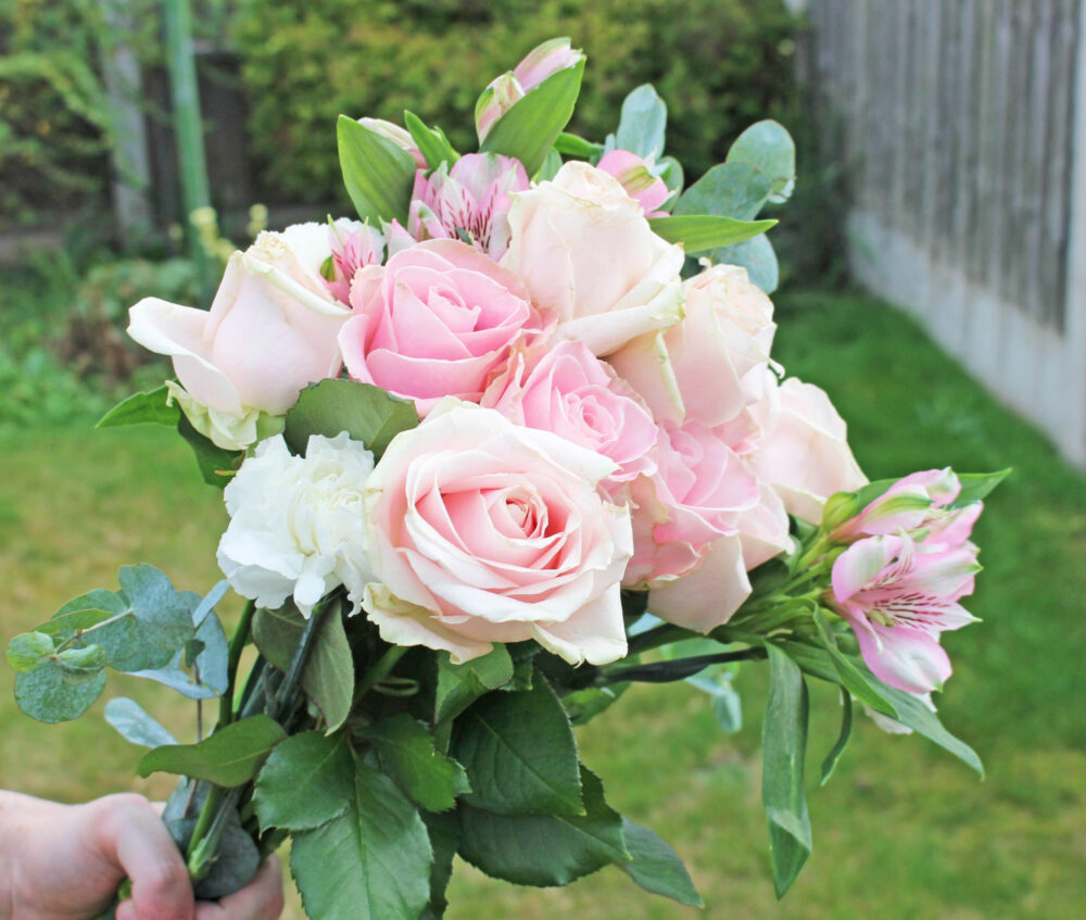 The Tyra from LOV Flowers pink Sweet Avalanche Roses and fragrant eucalyptus