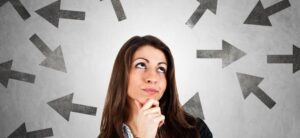 woman looking thoughtful with arrows around her