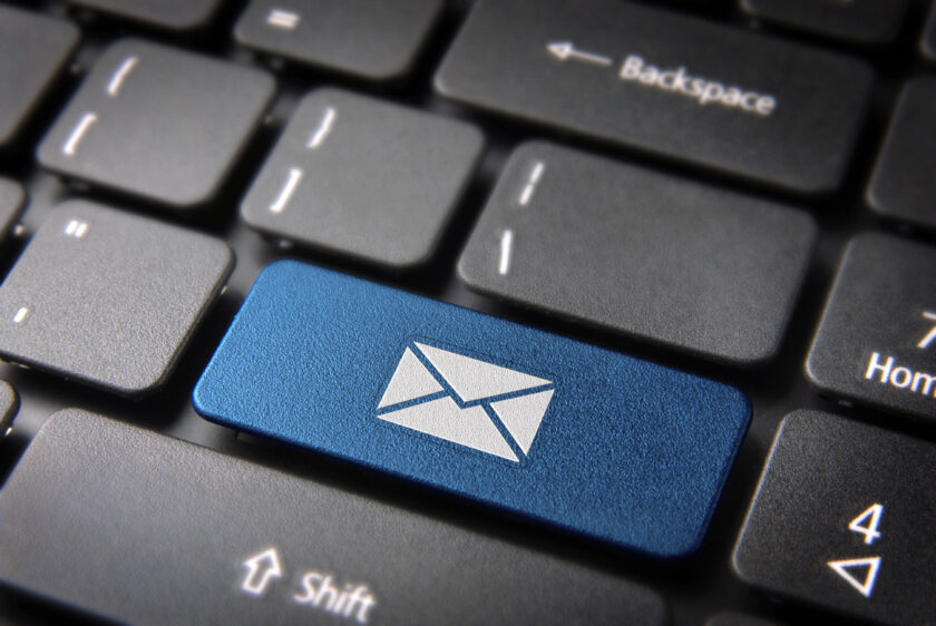 Blue email key on a keyboard