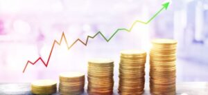 coins growing in stack size and next to a growing graph