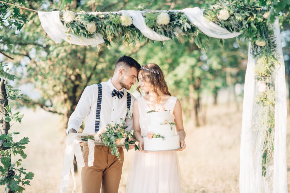 fine art wedding photography. bride and groom hugging at the wedding in nature.