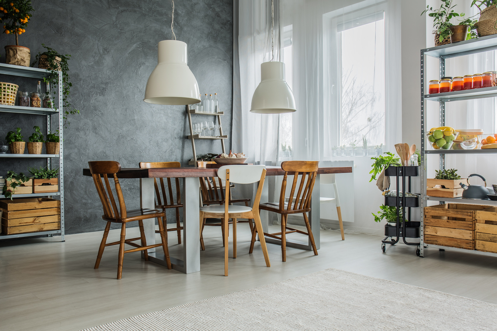 Cozy loft with dinning table, chairs and metal storage racks