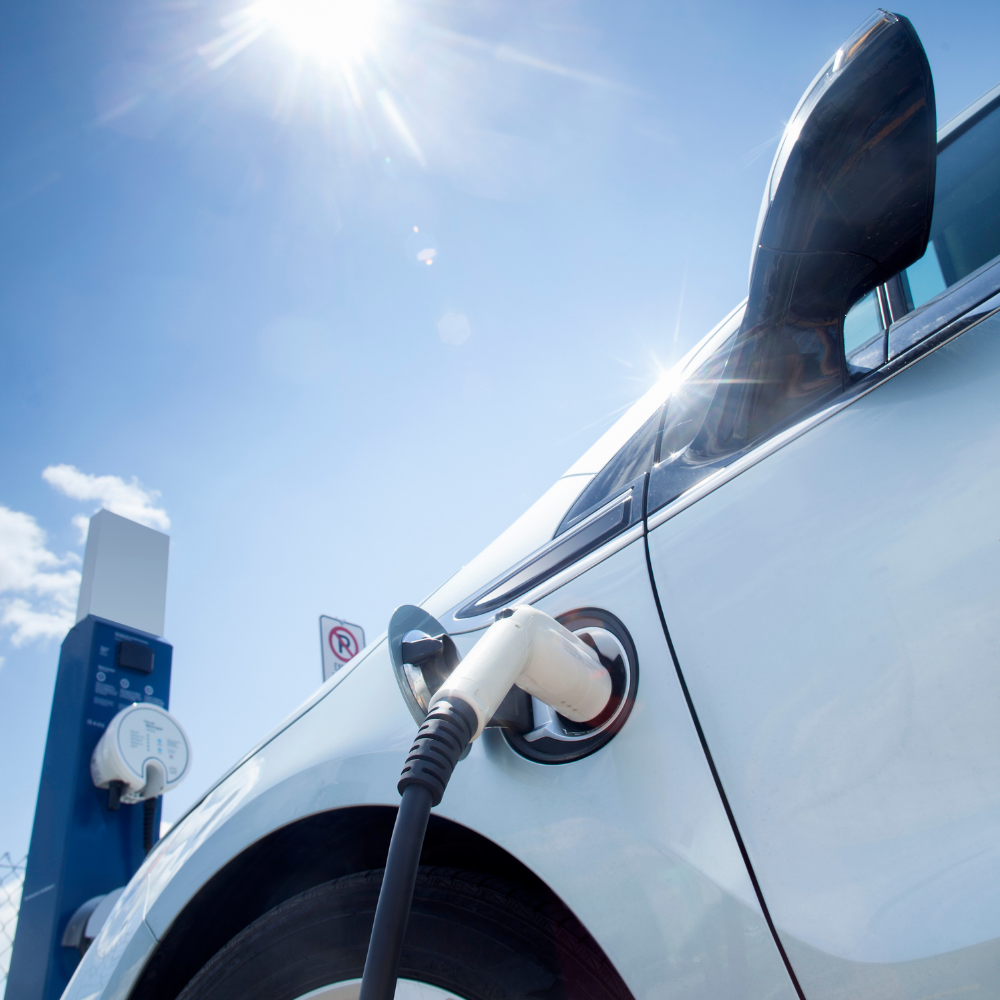 electric car with a charger in the charging port