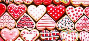 selection of hearts all decorated differently in pinks whites reds and a little blue