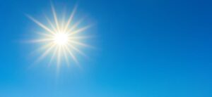 sun shining in the blue sky