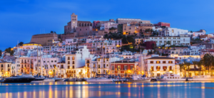 Ibiza Dalt Vila downtown at night with light reflections in the water