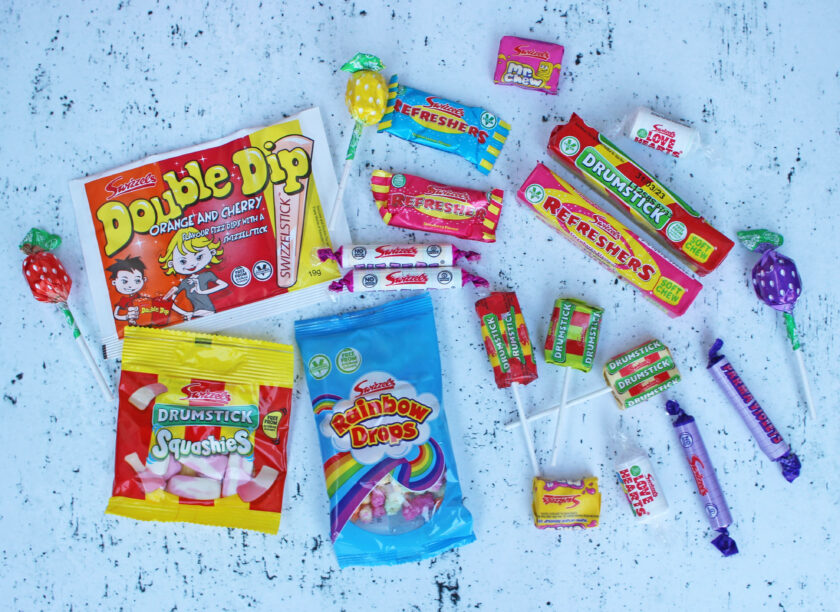 Collection of retro sweets from Swizzles laid out in a flat lay