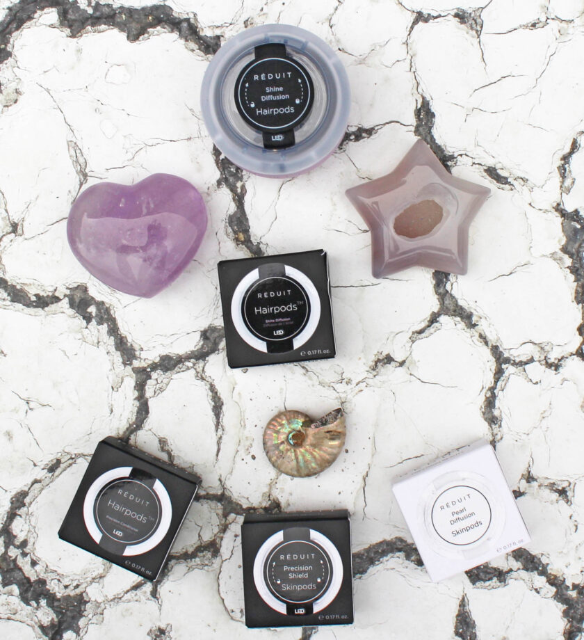 Réduit Uni Skin and Hair Device and Pods Flatlay