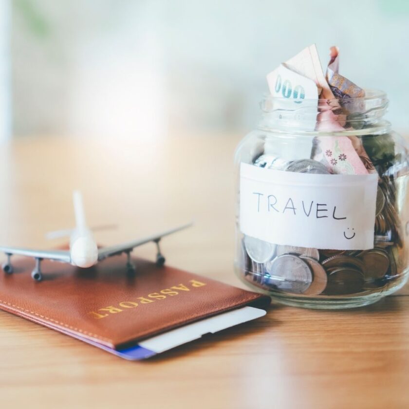 travel money saving passport and model plane