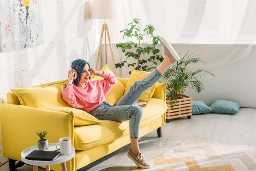 Living room area with a yellow sofa