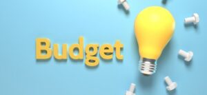 budget written in yellow next to a lightbulb
