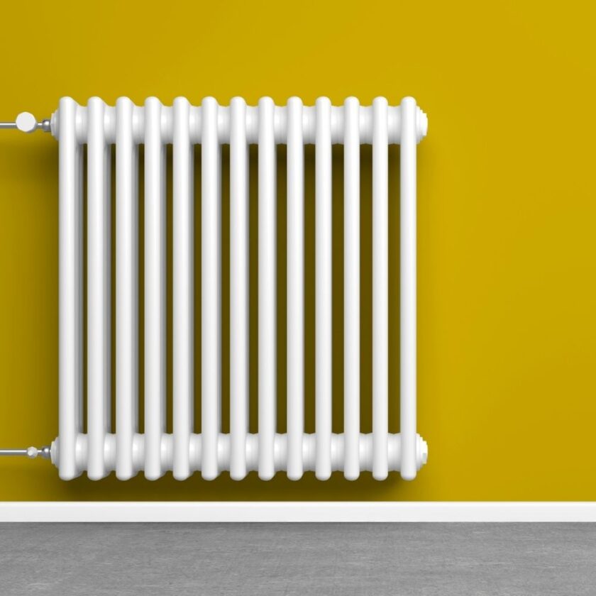 radiator fitted to mustard wall
