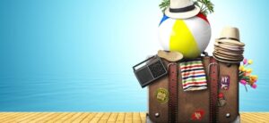 suitcase with holiday items on top of it