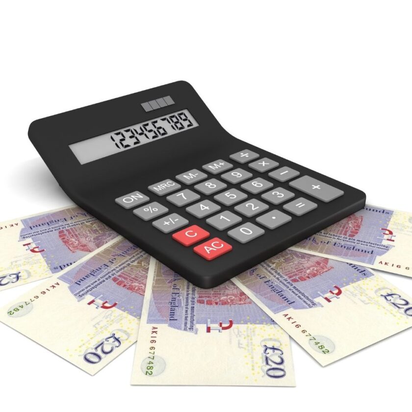 twenty pound notes spread out around a calculator
