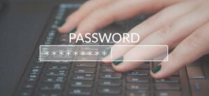womans hands on a keyboard with password on top