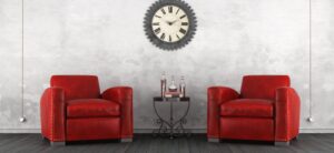 living room area with two red armchairs