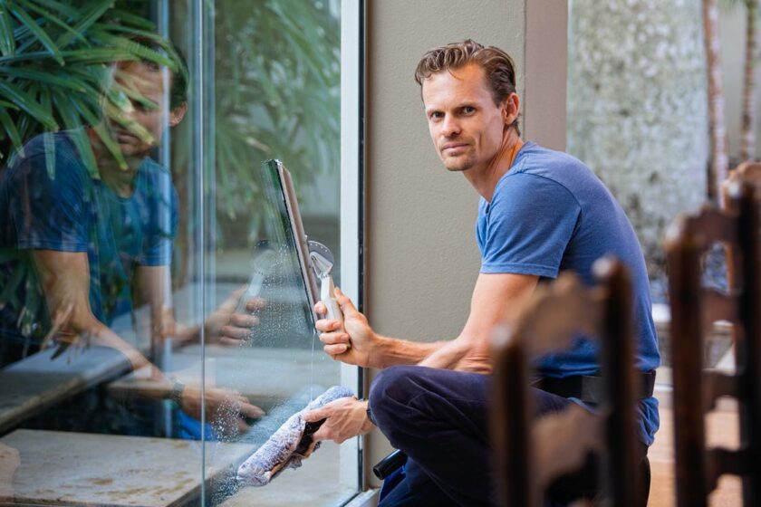 man cleaning windows