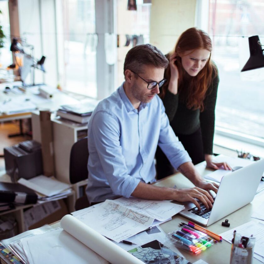 architects working on plans at a desk