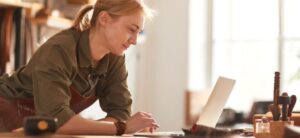 female business owner working on a laptop