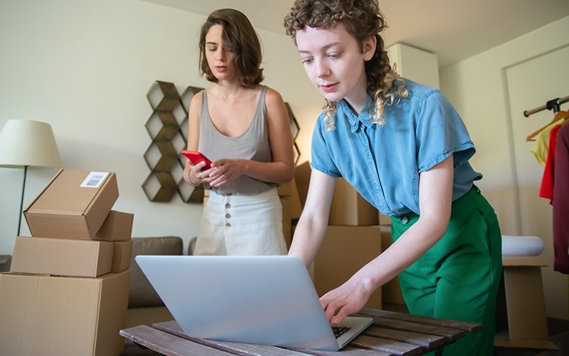 person selling online using a laptop